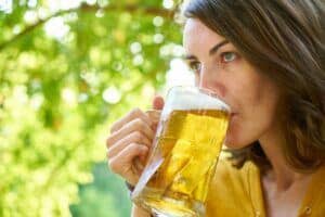 woman drinking a blonde ale home brew