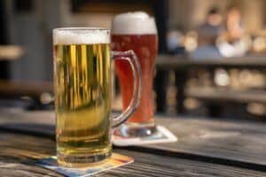 Lager and an Ale in beer glasses on bar