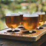 4 homebrewed beer in wine glasses